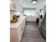 Well-lit kitchen with stainless steel appliances, quartz countertop, and contemporary design at 3304 Honeymoon Ln, Holiday, FL 34691