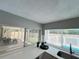 Kitchen view showcasing backyard with a covered patio at 3304 Honeymoon Ln, Holiday, FL 34691