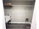 A well-organized laundry room featuring a utility sink and wire shelving for storage at 3304 Honeymoon Ln, Holiday, FL 34691