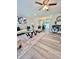 Bright living room featuring modern furnishings and wood-look flooring at 3304 Honeymoon Ln, Holiday, FL 34691