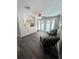 Bright and airy living space with white built-in cabinets and convenient access to the outdoor pool area at 3304 Honeymoon Ln, Holiday, FL 34691