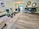 Inviting living room with modern decor, comfortable seating, and wood-look floors at 3304 Honeymoon Ln, Holiday, FL 34691