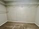 A well-sized walk-in closet with carpeted floors and built-in shelving at 3304 Honeymoon Ln, Holiday, FL 34691