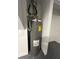 Image of a Rheem Classic Professional water heater in a utility space with durable, speckled flooring at 3304 Honeymoon Ln, Holiday, FL 34691