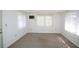 A bedroom featuring carpet, white walls, and multiple windows offering plenty of natural light at 3851 Redwood Dr, Holiday, FL 34691