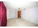 Cozy bedroom featuring closet space, ceiling fan, neutral flooring, and white walls at 3851 Redwood Dr, Holiday, FL 34691