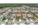Aerial view of a well-planned neighborhood with neatly arranged homes and beautiful landscaping at 4056 Burdick Loop, Odessa, FL 33556