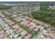 Scenic aerial perspective of a residential area with lakes, lush greenery, and well-maintained properties at 4056 Burdick Loop, Odessa, FL 33556