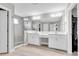 Primary bathroom with double vanity, seated makeup counter, tile flooring and a walk in shower at 4056 Burdick Loop, Odessa, FL 33556
