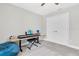 This bedroom has a simple desk with an electric keyboard, a plush beanbag, and a closet at 4056 Burdick Loop, Odessa, FL 33556