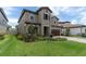 Beautiful two story home with a well-manicured lawn, stylish landscaping, and a tile roof at 4056 Burdick Loop, Odessa, FL 33556