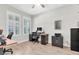 Functional home office with natural light, a large desk, and ample storage space for productivity at 4056 Burdick Loop, Odessa, FL 33556