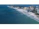 Stunning aerial view of a pristine white sandy beach, pier, and clear blue ocean at 4057 67Th N Ave, Pinellas Park, FL 33781