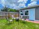 Cozy backyard features green grass, seating, and a fire pit, perfect for outdoor relaxation at 4057 67Th N Ave, Pinellas Park, FL 33781