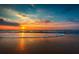 Beautiful beach sunset reflecting on the water and wet sand at 4057 67Th N Ave, Pinellas Park, FL 33781