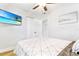 A bedroom with a ceiling fan, tile floors, closet, and a television on the wall at 4057 67Th N Ave, Pinellas Park, FL 33781
