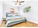 Bright bedroom features a large bed, wood-look floors, and lots of natural light at 4057 67Th N Ave, Pinellas Park, FL 33781