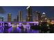 Night cityscape view of Tampa's skyline reflecting on the river, highlighted by illuminated bridges at 4057 67Th N Ave, Pinellas Park, FL 33781