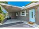 Single-story home featuring a covered carport, manicured landscaping, and a paved driveway at 4057 67Th N Ave, Pinellas Park, FL 33781