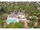 Overhead shot showcasing community amenities: pool, splash pad, playground, parking, and landscaping at 4094 Braemere Dr, Spring Hill, FL 34609