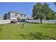 Generous backyard offering various outdoor recreation and lounging options, with a full privacy fence at 4094 Braemere Dr, Spring Hill, FL 34609