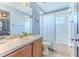 Bathroom featuring a single vanity with wood cabinetry and a shower tub combo at 4094 Braemere Dr, Spring Hill, FL 34609