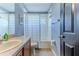 Cozy bathroom featuring a shower-tub combination, and clean blue walls at 4094 Braemere Dr, Spring Hill, FL 34609