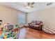 Bright room with hardwood floors, a leather sofa, and a window at 4094 Braemere Dr, Spring Hill, FL 34609