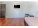 Spare bedroom with hardwood floors, ceiling fan, daybed, and natural light at 4094 Braemere Dr, Spring Hill, FL 34609