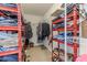 Spacious walk-in closet with organized shelving, offering ample storage space at 4094 Braemere Dr, Spring Hill, FL 34609