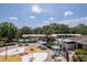Community splash pad, playground and pool area with covered seating under the pavilion at 4094 Braemere Dr, Spring Hill, FL 34609