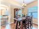 Dining area featuring a wood table, pendant lighting and hardwood floors at 4094 Braemere Dr, Spring Hill, FL 34609