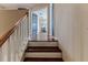 Upstairs hallway featuring wood floors and doors leading to bedrooms and bathrooms at 4094 Braemere Dr, Spring Hill, FL 34609