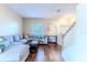 Comfortable living room with hardwood floors, neutral paint, and large sectional sofa at 4094 Braemere Dr, Spring Hill, FL 34609