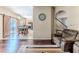 Cozy living room with hardwood floors, opening to the dining area and staircase at 4094 Braemere Dr, Spring Hill, FL 34609
