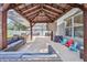 Inviting covered patio with comfortable seating and entertainment area for relaxing outdoors at 4094 Braemere Dr, Spring Hill, FL 34609