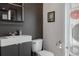 Half bath featuring vessel sink with modern fixtures and a stylishly decorated powder room at 4215 Maplehurst Way, Spring Hill, FL 34609
