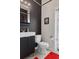Stylish half bath featuring vessel sink, modern fixtures, and a designer mirror at 4215 Maplehurst Way, Spring Hill, FL 34609