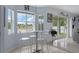 Eat-in kitchen nook featuring large windows with a view of the backyard at 4215 Maplehurst Way, Spring Hill, FL 34609