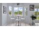 Bright breakfast nook with large windows offering beautiful backyard views at 4215 Maplehurst Way, Spring Hill, FL 34609