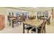 Spacious dining room setup with marble-top tables and comfortable seating perfect for community meals and gatherings at 4215 Maplehurst Way, Spring Hill, FL 34609
