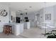 Modern kitchen with updated stainless appliances, light gray cabinets and tile flooring at 4215 Maplehurst Way, Spring Hill, FL 34609