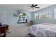 Serene main bedroom with large windows, TV, and a tranquil color scheme at 4215 Maplehurst Way, Spring Hill, FL 34609