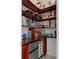 Walk-in pantry with custom shelving and a mini refrigerator for maximum storage and convenience at 4215 Maplehurst Way, Spring Hill, FL 34609