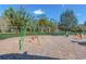 Community playground area featuring swings and spring riders for Gathering fun at 4215 Maplehurst Way, Spring Hill, FL 34609