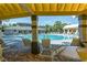 Community pool with lounging chairs and a covered patio for shade offers a relaxing place to unwind at 4215 Maplehurst Way, Spring Hill, FL 34609