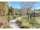 Community walking path featuring beautiful landscaping and tranquil areas for residents at 4215 Maplehurst Way, Spring Hill, FL 34609