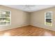 Bright bedroom with two large windows and light hardwood floors at 4221 San Rafael Ave, New Port Richey, FL 34655