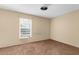 Bedroom featuring plush carpeting and a window at 4221 San Rafael Ave, New Port Richey, FL 34655
