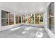 Enclosed Florida room with tiled floor and lots of natural light at 4221 San Rafael Ave, New Port Richey, FL 34655